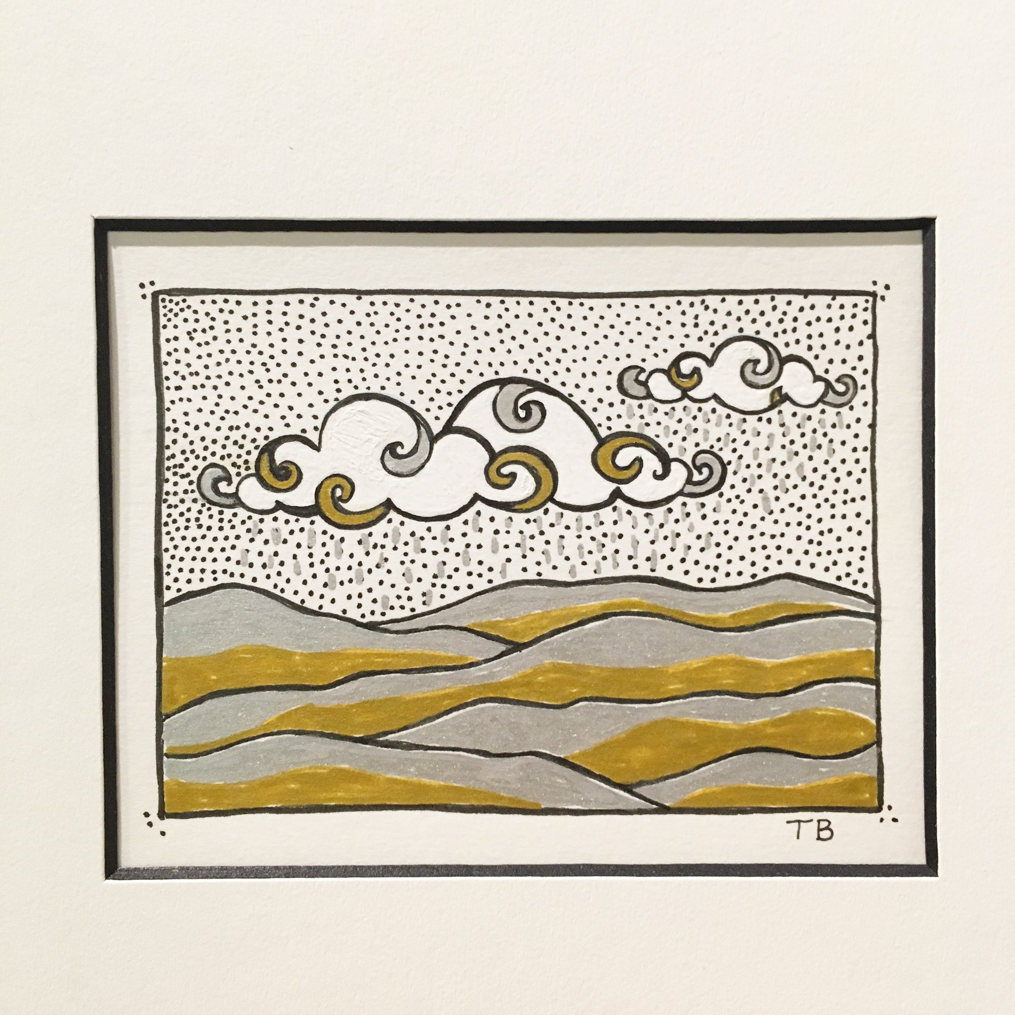 Gold, silver and black ink drawing on paper. Clouds and hills mountains. Tiny art.