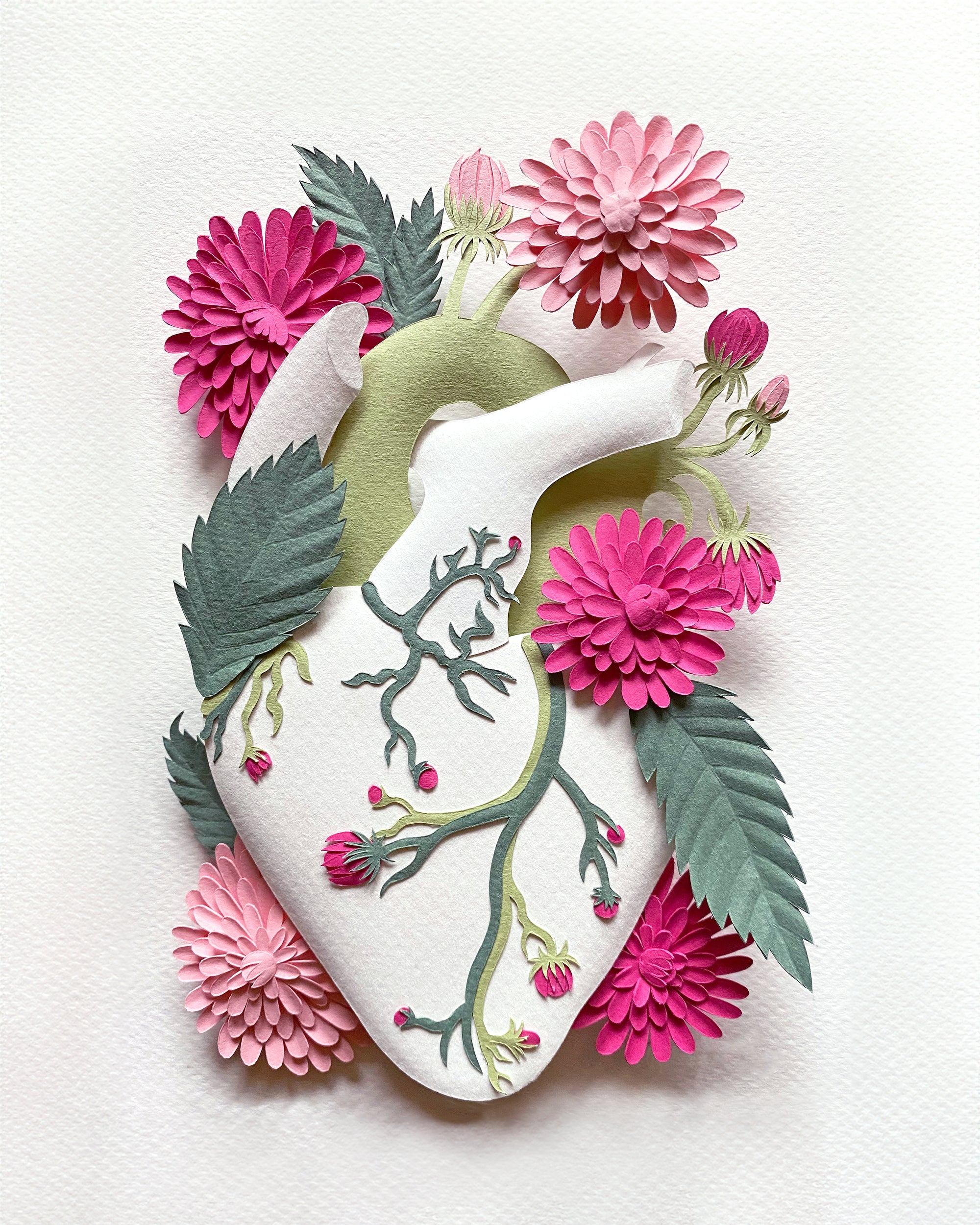 Anatomical heart made of cut paper with dahlia flowers