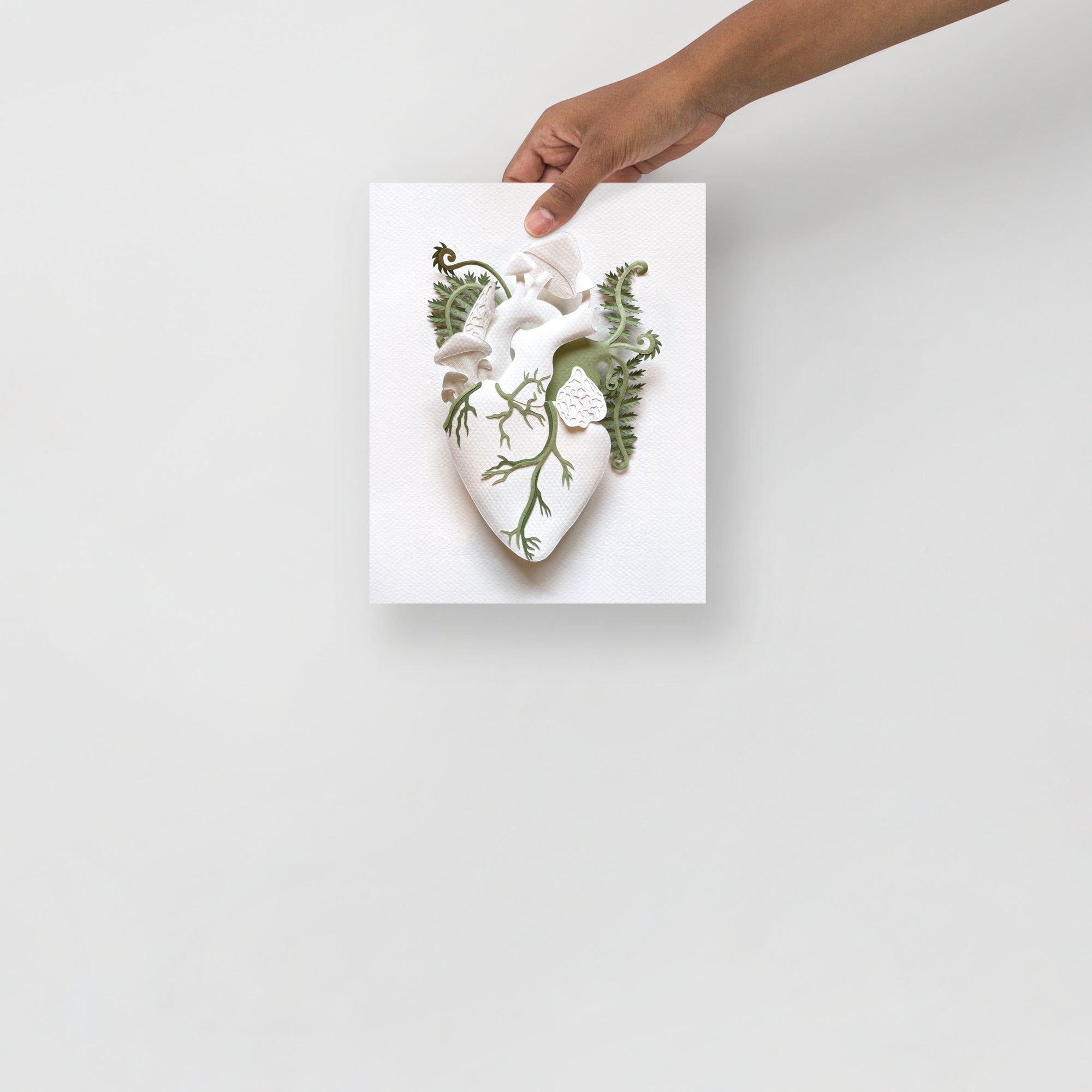 anatomical heart with mushrooms and ferns made of hand cut paper