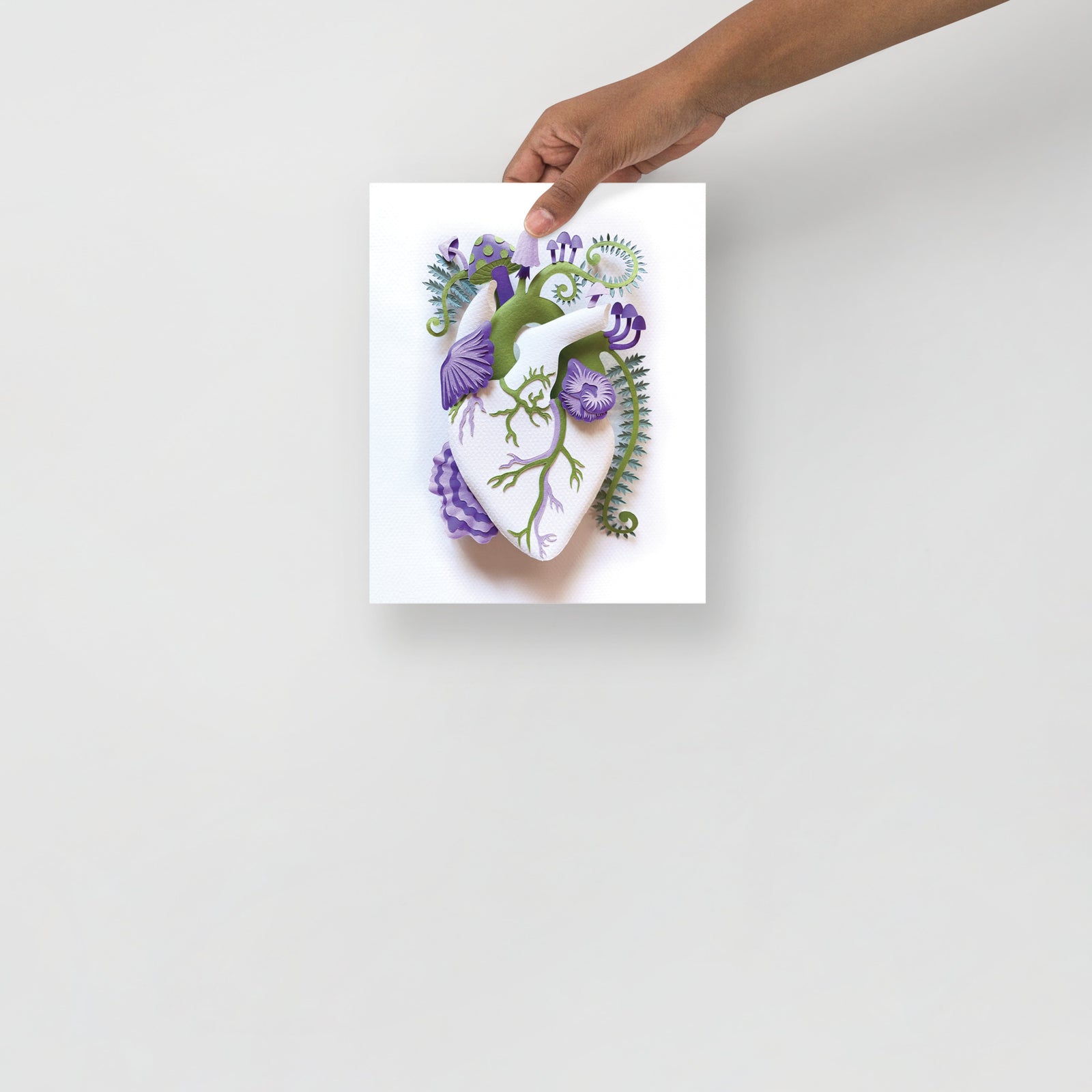 Anatomical heart with purple mushrooms made of hand cut paper